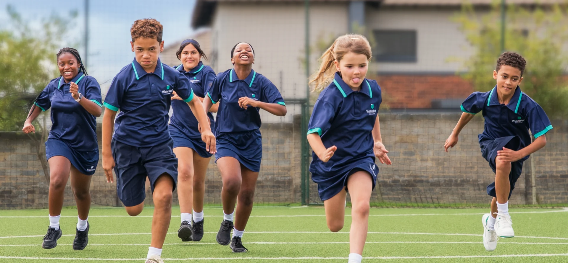 Waterford College students running on the field